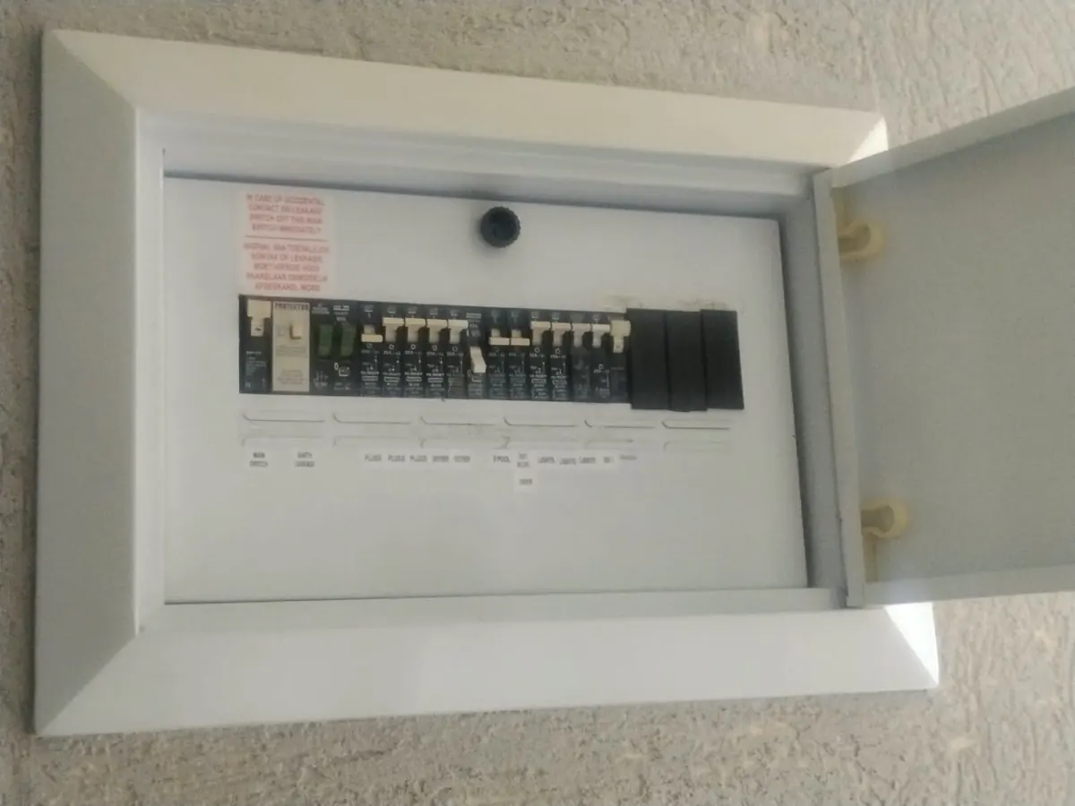Home distribution board with labelled circuit breakers for plugs, geyser and lights